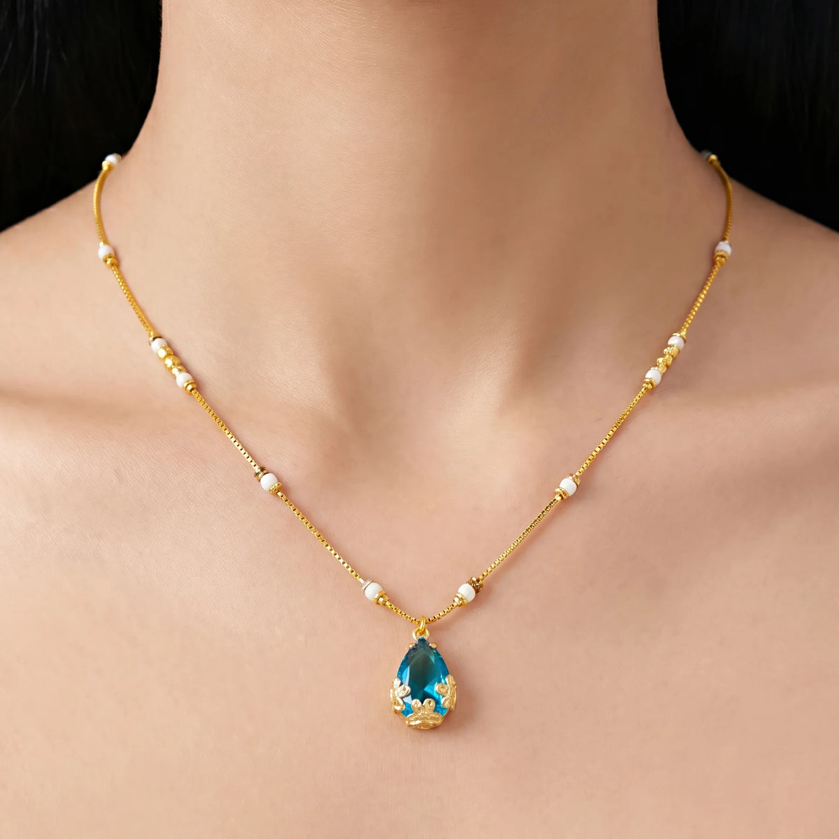 AYMI Necklace Anti-Tarnish Blue
Teardrop Crystal Pendant Beaded
Spacer Chain