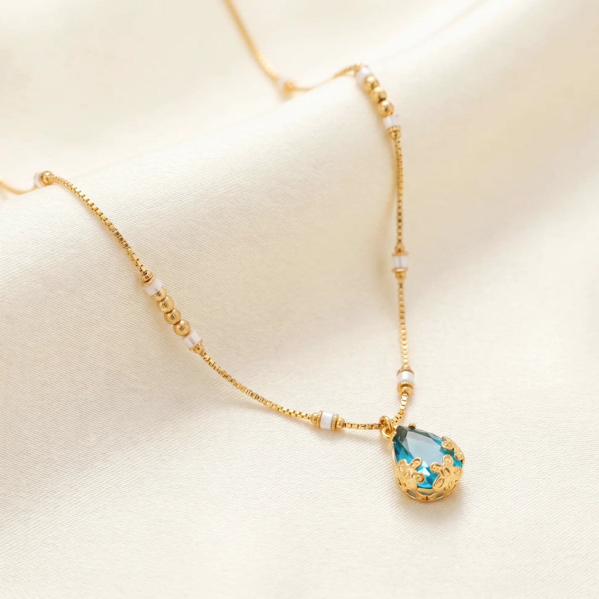 AYMI Necklace Anti-Tarnish Blue
Teardrop Crystal Pendant Beaded
Spacer Chain